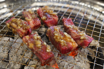 Thick beef grilled directly on a charcoal grill