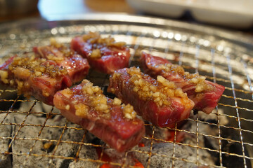 Thick beef grilled directly on a charcoal grill