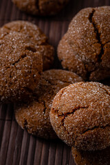 Warm Homemade Gingersnap Cookies on a wooden brown board