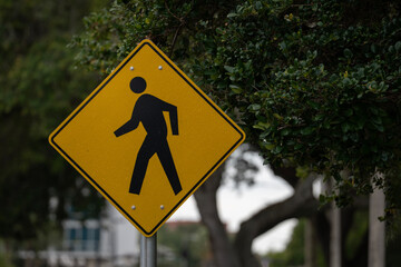 yellow pedestrain people crossing sign