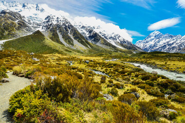 Glacial stream between rocks and gravel in Hooker Valley from Aoraki Mount Cook, highest peak of Southern Alps an icon of New Zealand