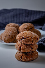 Warm Homemade Gingersnap Cookieson a light background, a gray handkerchief