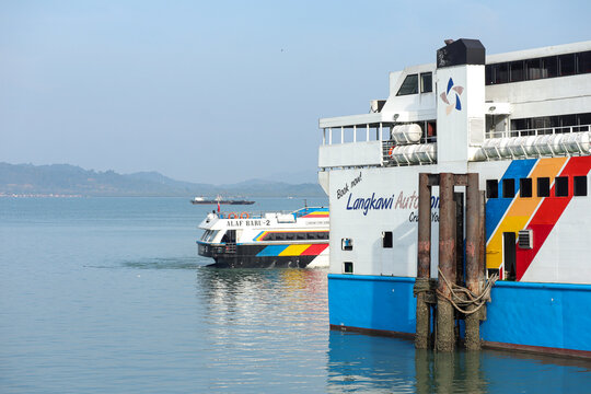 Langkawi, Malaysia March 11, 2024: the pier and the ferry boat at harbor in Langkawi Malaysia.