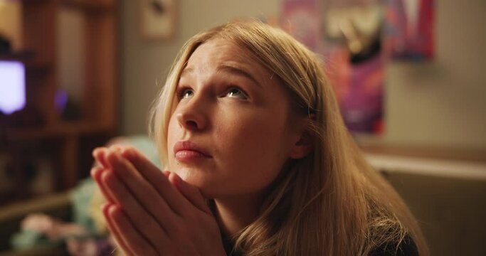Hope, hands and woman in a house praying for help, depression or solution closeup. Pray, worship and female person at home with prayer to Jesus Christ for mercy, praise or asking for anxiety support