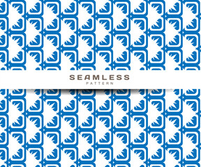 seamless pattern, squares forming triangles in blue on a white background