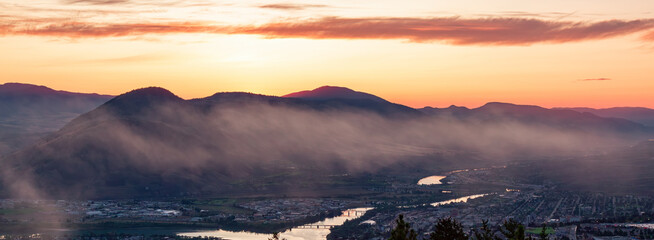 Sunrise over Kamloops, BC, Canada. Sunny Cloudy Morning
