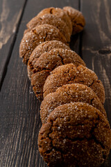 Warm Homemade Gingersnap Cookies on a dark background