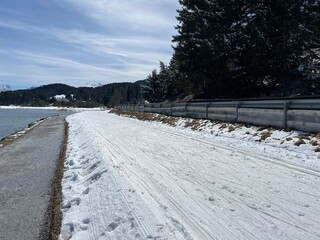 A winter sport cross-country ski trail around a frozen alpine Heidsee lake (Igl Lai lake) in the Swiss winter resorts of Valbella and Lenzerheide - Canton of Grisons, Switzerland (Schweiz)