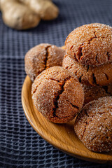 Warm Homemade Gingersnap Cookies on a gray handkerchief