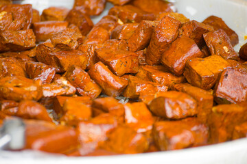 a stall brimming with tofu, each piece meticulously flavored