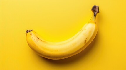 Banana on a yellow background. An exotic fruit. Delicious and juicy bananas are bright yellow in color.