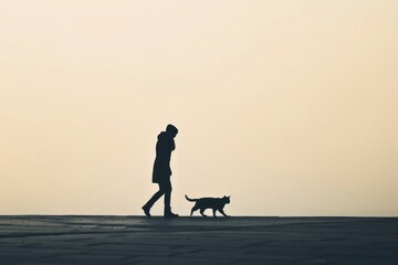 Person walking a cat backlighting clothing footwear.