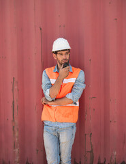 Portrait of a handsome engineer under inspection and checking production process on dock station...