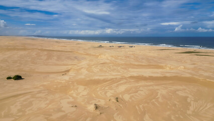 Walk through the sand dunes to Tin City