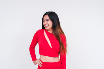 Happy Asian woman in a red dress smiling, isolated on white background