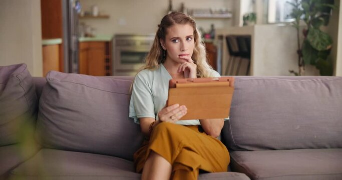 Tablet, search or woman on sofa thinking, planning or curious about home, loan or mortgage application process. Why, questions or female person in living room with digital app for credit score check