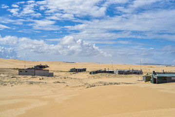 Walk through the sand dunes to Tin City