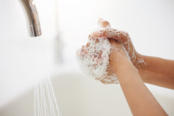 Woman, tap and washing hands with water or soap for hygiene, disinfection or bacteria and germ...