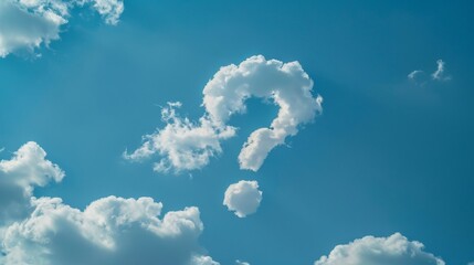 A cloud formation resembling a question mark hangs in a clear blue sky with a single  