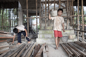 child labor concept. Children working at construction site, Poor children, poverty.
