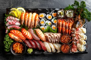 Fotobehang A black tray with a variety of sushi and other seafood dishes © Bonya Sharp Claw