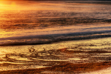 North-eastern European river after frosty winter. Ice began to melt, ice is saturated with...