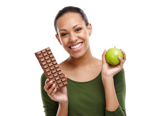 Portrait, happy woman and chocolate versus apple for health, wellness and diet benefits. Smile,...