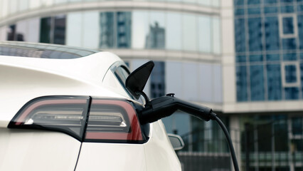 Close-up of a modern electric car charging. The concept of modern technologies, advertising of...