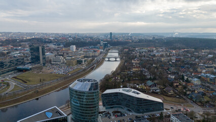 Drone photography of old and new buildings in city center during spring day