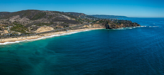 Aerial View of Newport Beach, California with Rocky Coastline and Highway