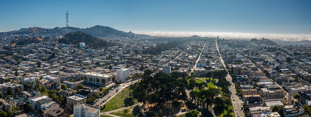 Aerial View of San Francisco Cityscape and Hills Under Blue Sky