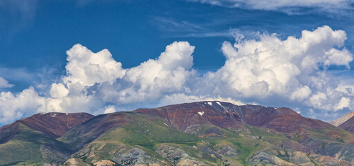red and green mountains under white clouds landscape