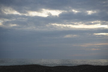 horizon line over Black sea water. sea sky sunset sun landscape. Dramatic heaven during sunset.