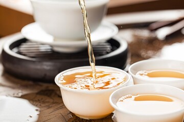 Brewing chinese tea ceramic gaiwan tea ceremony closeup 4