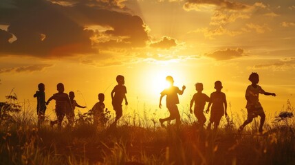 A silhouette of a multicultural group of children playing in an open field, with the setting sun behind them