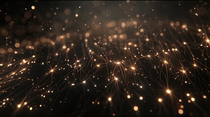   A close-up of a black background filled with numerous golden sparklers in its center