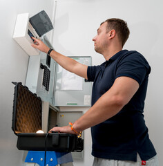 A technician works with a demo kit of the smart home system