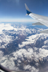 view from the plane to the Alps