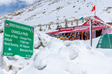 Sign marking the summit of Changla Pass at 17,586 feet in the Himalayan Mountains in northern India