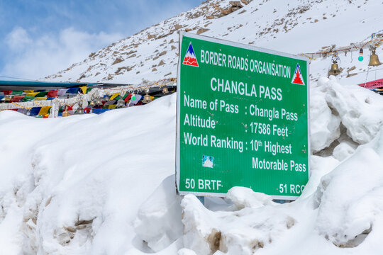 Sign marking the summit of Changla Pass at 17,586 feet in the Himalayan Mountains in northern India