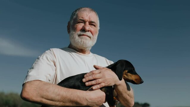 Sunset Serenade Elderly Gentleman and Dachshund Relish Time Together