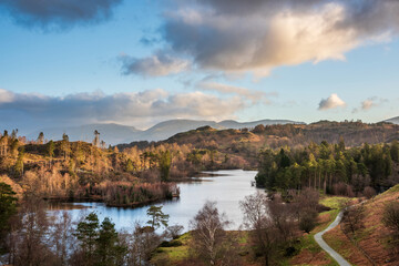 Beautiful Spring landscape image in Lake District looking towards Langdale Pikes during colorful...
