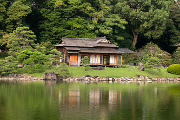 Traditional Japanese chashitsu tea room called Tsubame-no-ochaya or Swallow teahouse along the Shiori-no-ike pond of the Hama-rikyū Gardens