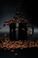 coffee beans and coffee mug falling beans in mug
