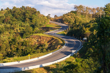 Curve road No. 3 or sky road on (root 1081) over top of mountains with green jungle in Santisuk -...