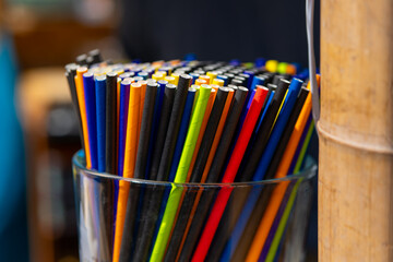 colorful cardboard straws in a jar