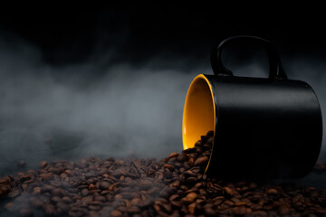 coffee beans and cup on black close up with smoke 