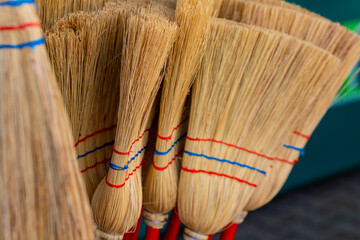 bunch of brooms with red and blue stripes