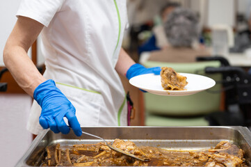 Close up of a Nurse serving food to senior people at nursing home. High quality photography