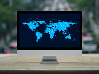 Connection line with global world map on computer monitor screen on table over blur of rush hour road in city, Technology communication online concept, Elements of this image furnished by NASA